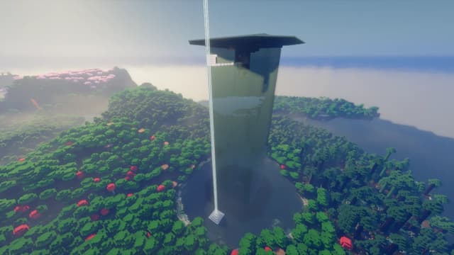 Tall dark green farm tower with an overhanging roof, surrounded by forest and a pool of water, with a beacon beam beside it