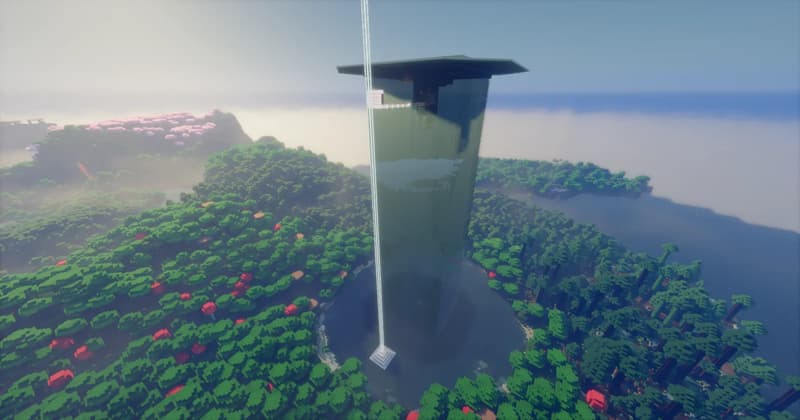 Tall dark green farm tower with an overhanging roof, surrounded by forest and a pool of water, with a beacon beam beside it