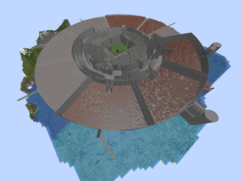 Aerial view of the circular structure with its red and grey floor pattern, spoke paths and the maze core at the centre